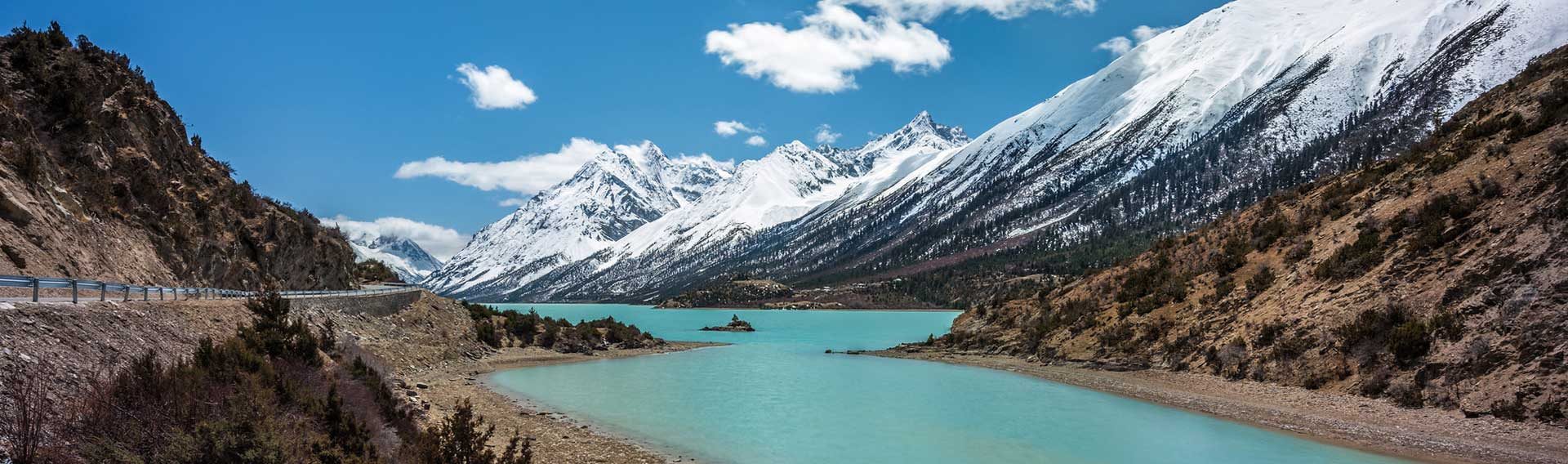 Basum Tso lake below snow mountains