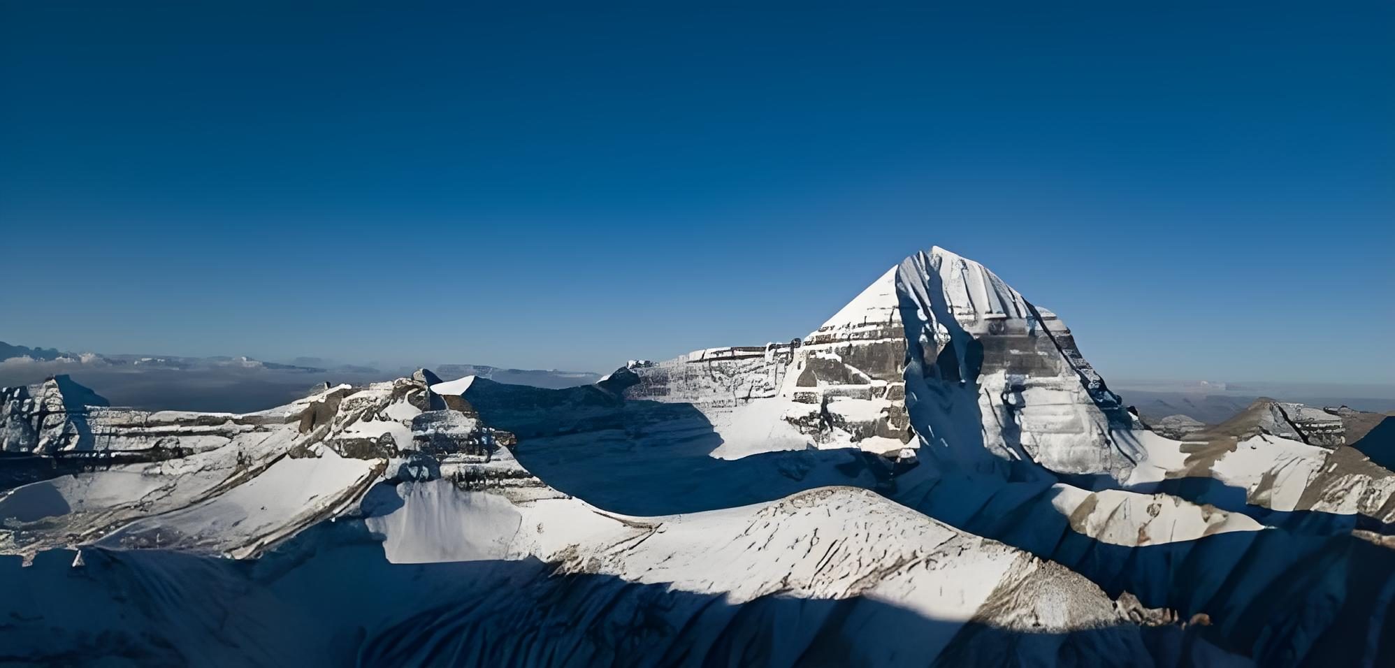 Mount Kailash above snowy ridges