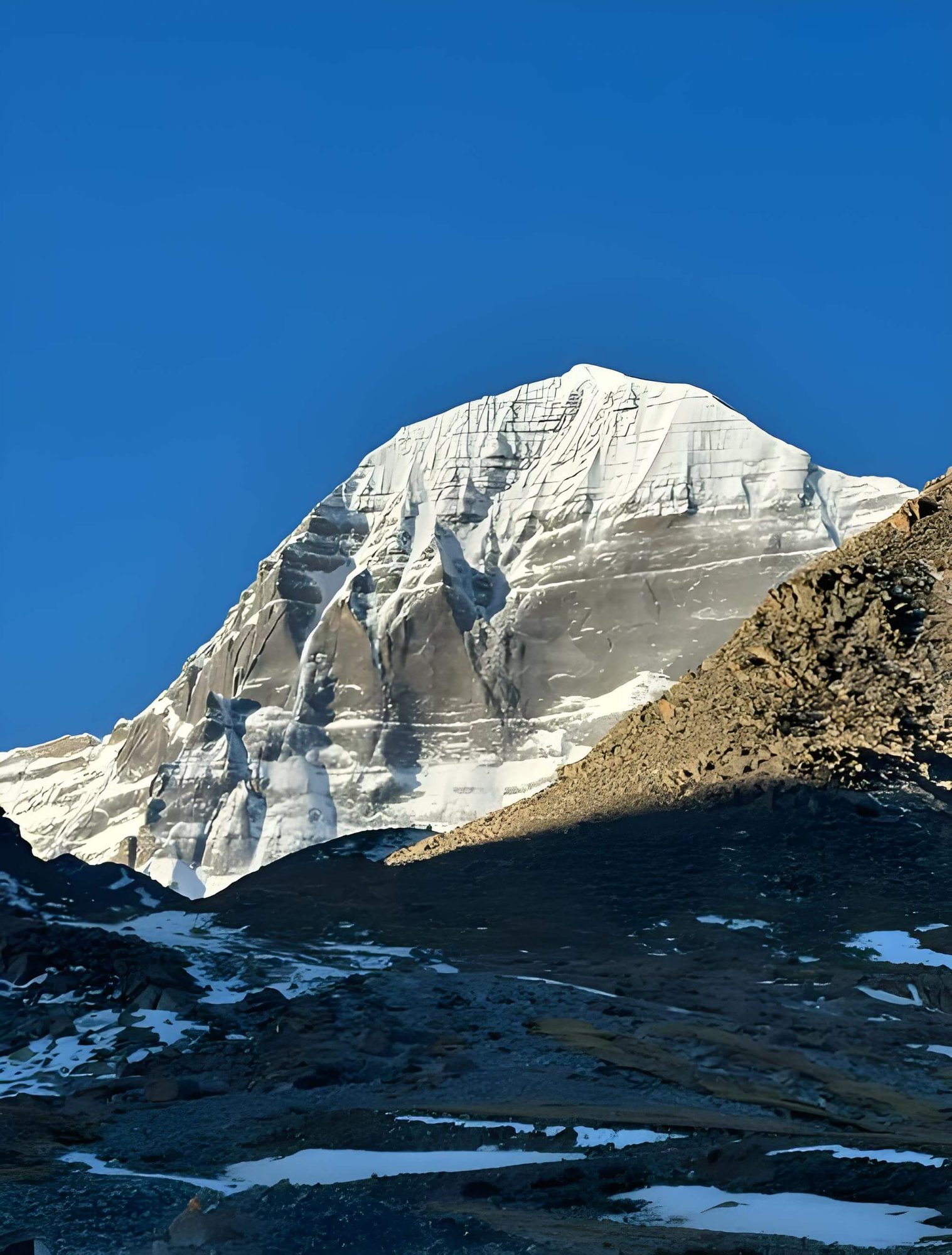 Snow-covered face of Mount Kailash seen from the kora path