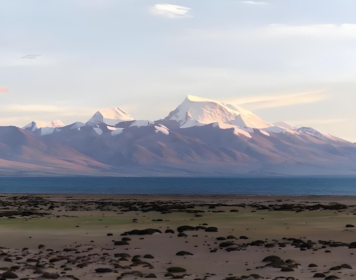 Snow mountains above Lake Manasarovar in evening light