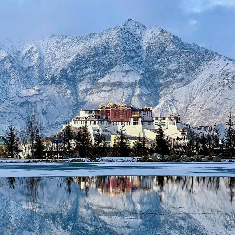Potala Palace reflected in still water on a clear winter day in Lhasa