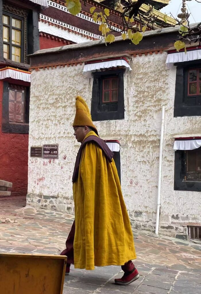 Monk in a yellow robe at Tashilhunpo Monastery, Shigatse