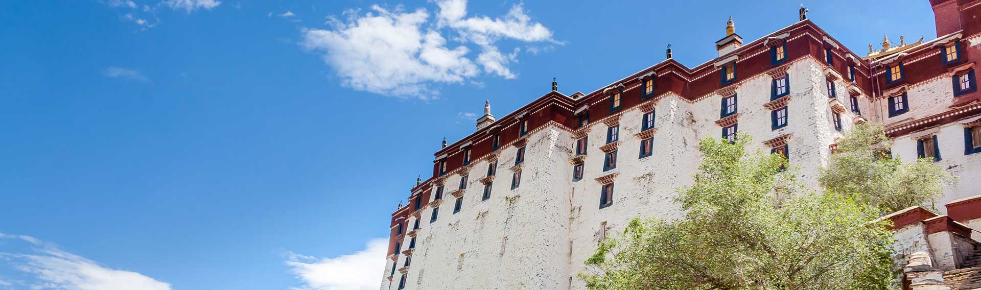 White walls of the Potala Palace against a blue sky