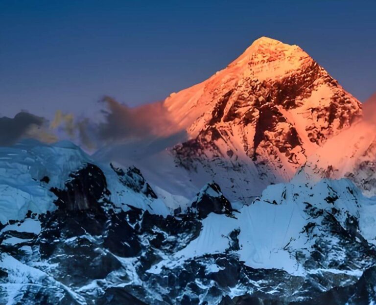 Everest summit glowing pink at sunset