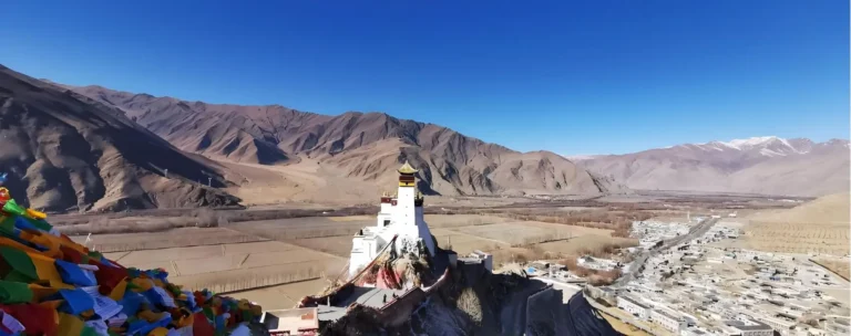 Small monastery on a ridge above a wide valley