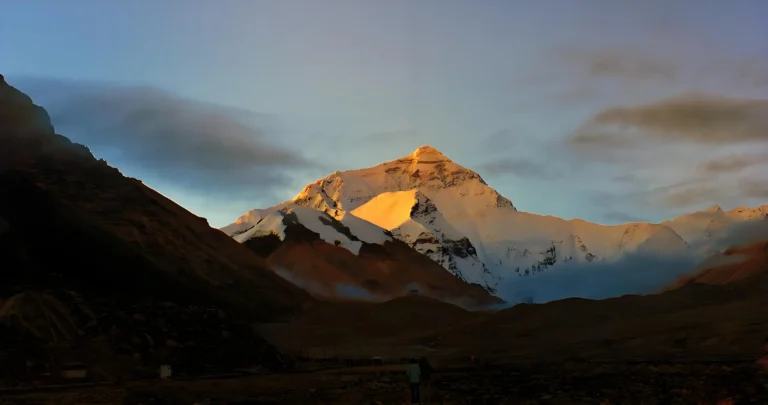 Everest north face lit gold at sunset